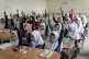 Afghan school girls attend their classroom on the first day 