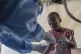 A health worker attends to a mpox patient, at a treatment ce