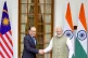 Indian Prime Minister Narendra Modi (right) shakes hand with