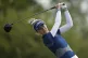 Nelly Korda, of the United States, hits her shot from the 14