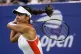Emma Raducanu returns a shot to Alize Cornet during the firs