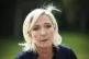 French far-right leader Marine Le Pen answers reporters at t