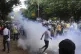 Police fire tear gas shells to disperse people protesting ag