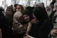 Mourners cry during the funeral of five Palestinians who wer