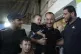 Ismail Al-Qadi (centre) holds one of the sons of his brother