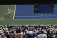 Dusan Lajovic returns a shot to Daniil Medvedev during the f