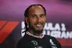 Mercedes driver Lewis Hamilton of Britain smiles while atten
