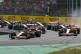 McLaren driver Lando Norris of Britain (left) leads the fiel