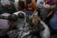 Palestinians mourn a relative killed by the Israeli bombardm