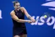 Aryna Sabalenka returns to Zheng Qinwen during the quarter-f