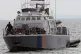 People aboard a Cyprus marine police patrol boat as they're 