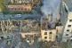 Smoke rises from a building which was destroyed by a Russian