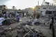 Palestinians inspect the damage in the courtyard of Al Aqsa 