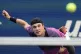 Jack Draper returns a shot to Jannik Sinner during the men's