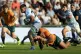 Argentina's Los Pumas Joaquin Oviedo is tackled by Australia
