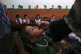 A health worker administers a polio vaccine to a child at a 