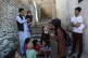 Shabana Maani, gives a polio vaccination to a child in the o
