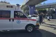Civil Defence first-responders carry a man who was wounded a