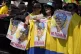 People hold posters in support of Colombia's President Gusta