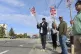 Union machinists and supporters wave picket signs in Everett