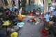 Families displaced by gang violence do laundry inside a scho