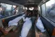 Mourners transport the bodies of their relatives killed by a