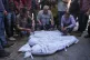 Palestinians mourn their relatives, including kids killed in