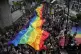 Participants hold a rainbow flag during the Pride Parade in 