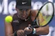Japan's Naomi Osaka returns a shot against Italy's Lucia Bro