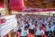 Samsung workers who are on strike shout slogans during a pro
