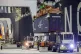 Five ship to shore cranes and gangs of longshoremen work the