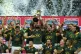 South Africa players celebrate with the trophy after defeati