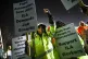 Dockworker Meikysha Wright and others strike outside the Vir