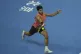 Carlos Alcaraz of Spain returns a shot from Daniil Medvedev 