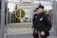 Police officers guard the Moscow City Court entrance, in Mos
