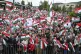 Participants wave national flags during a demonstration orga