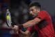 Novak Djokovic of Serbia plays a backhand return against Fla