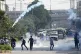 Police fire tear gas to disperse students protesting over an