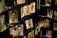 Family photographs of some of those who died hang in a displ