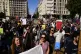 Striking teachers and supporters chant slogans during a prot
