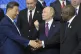 Russian President Vladimir Putin (centre) gestures while Chi