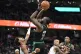 Boston Celtics guard Jaylen Brown (centre) scores over Washi