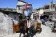Residents pack up their belongings to flee their homes to es