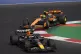 Max Verstappen steers his Red Bull followed by McLaren drive