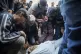 Palestinians mourn their relatives killed in the Israeli bom