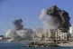 Smoke rises from buildings hit in Israeli air strikes in Tyr