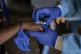 A health worker attends to a mpox patient, at a treatment ce