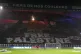 A giant banner reads ‘Free Palestine’ before the Champio