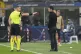 Referee talks with Arsenal's manager Mikel Arteta during a C