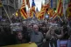 Demonstrators gather for a protest organised by social and c